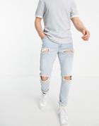 Asos Design Skinny Jeans With Heavy Rips In Vintage Light Wash-blues