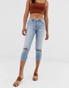 Asos Design Lisbon Mid Rise Cropped Skinny Jeans In Mid Stone Wash With Ripped Knees-blue