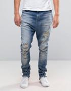 Asos Drop Crotch Stacked Jeans With Rips And Bleaching In Mid Blue - B