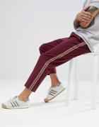 Asos Design Tapered Pants In Burgundy With Side Stripe Tape - Red