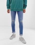 Asos Design Super Skinny Jeans In Light Wash With Knee Rips-blue