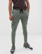 Asos Design Skinny Sweatpants With Cargo Pocket In Khaki Acid Wash - Green