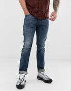 Diesel Buster Regular Slim Tapered Fit Jeans In 084as Mid Wash - Blue