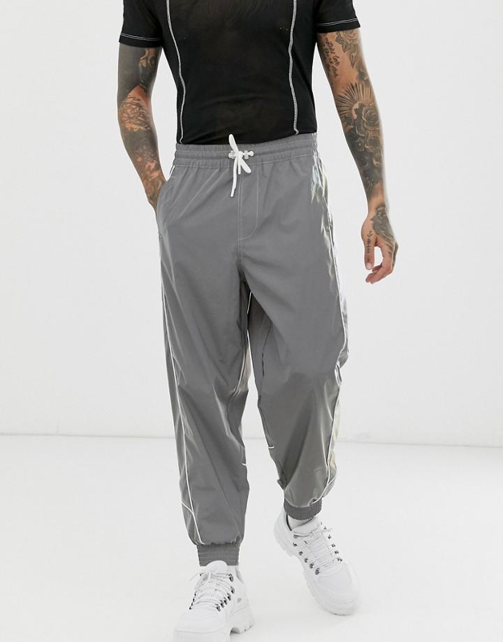 Asos Design Oversized Tapered Sweatpants In Reflective Fabric With Piping - Silver