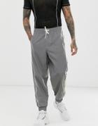Asos Design Oversized Tapered Sweatpants In Reflective Fabric With Piping - Silver