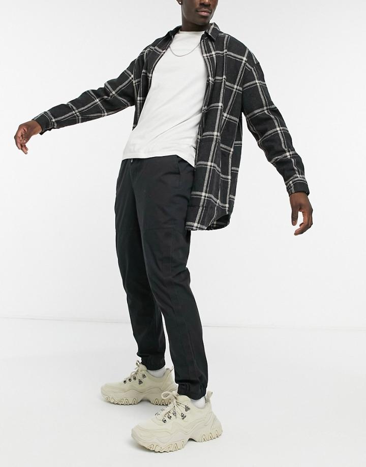 Asos Design Tapered Pants With Tape Detailing In Heavy Wash Black