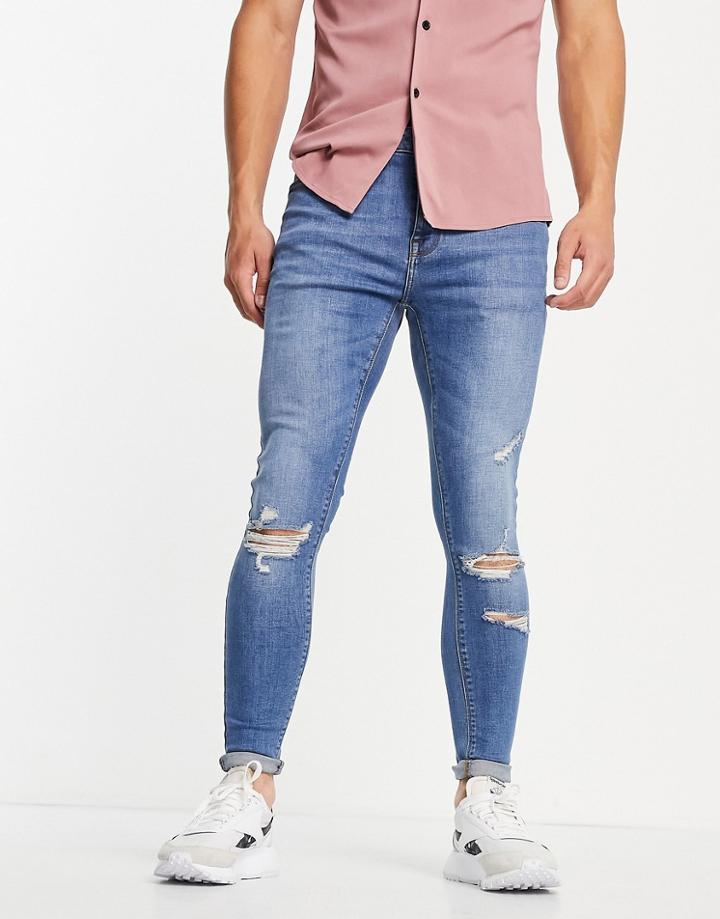 Asos Design Spray On Jeans With Power Stretch In Mid Wash With Rips-blues