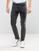 Asos Skinny Jeans With Stepped Hem And Raw Waistband In Washed Black -