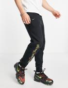 Nike Go The Extra Smile Pack Graphic Cuffed Fleece Sweatpants In Black