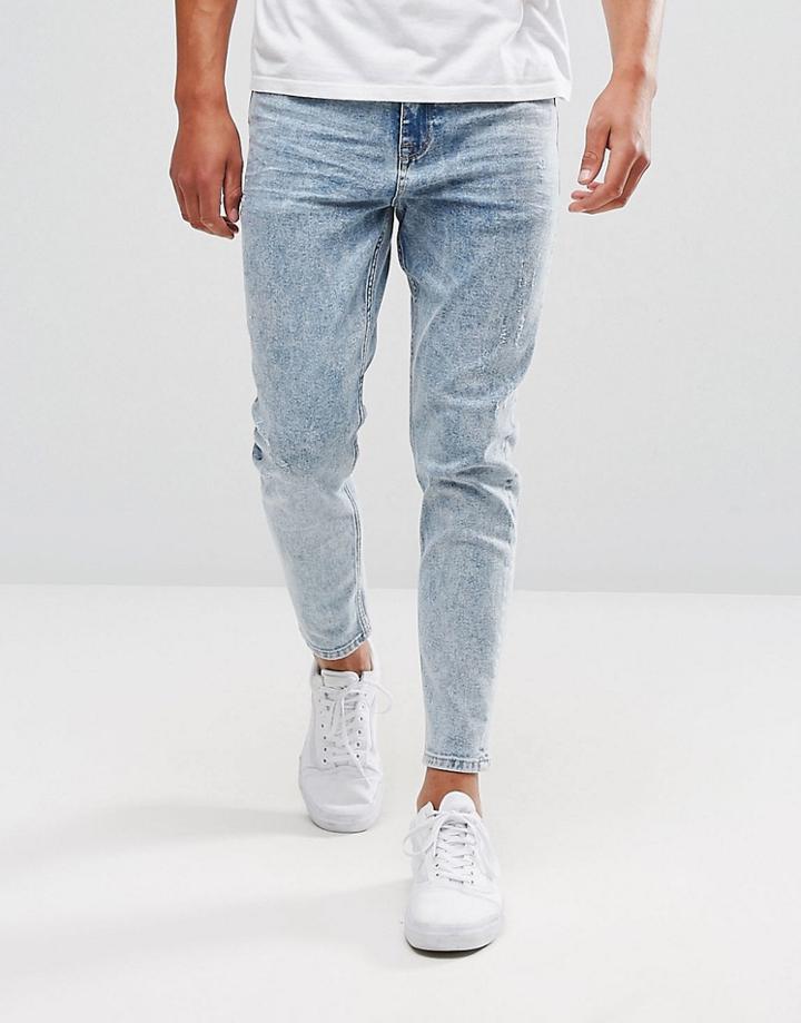 Asos Tapered Jeans In Bleach Wash With Abrasions - Blue
