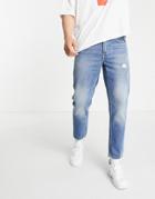 Asos Design Organic Cotton Blend Classic Rigid Jeans In Mid Wash Blue With Abrasions-blues