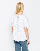 Asos Denim Top With Tie Back And Raw Hem Peplum In White - White