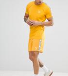 Puma Shorts With Taped Side Stripe In Yellow Exclusive To Asos - Yellow