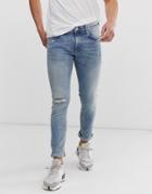 River Island Super Skinny Jeans With Rip & Repair In Light Blue Wash