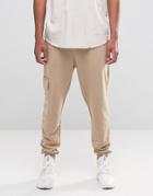 Asos Tapered Joggers With Cargo Pockets And Military Print - Beige