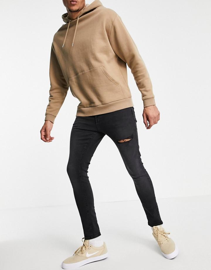 Asos Design Spray On Jeans With Powerstretch In Washed Black With Thigh Rip