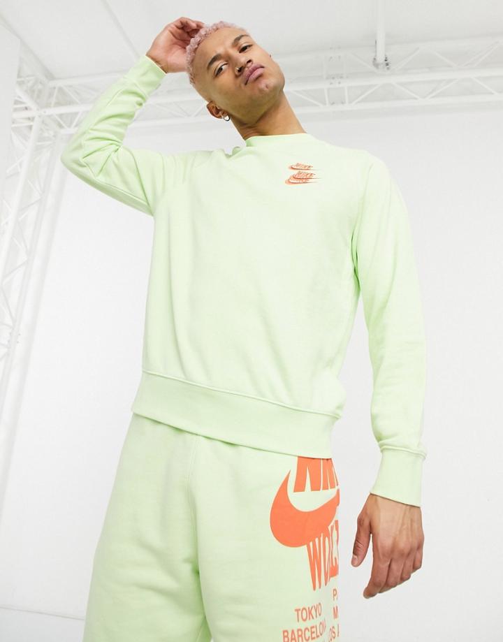 Nike World Tour Pack Graphic Crew Neck Sweatshirt In Lime-green