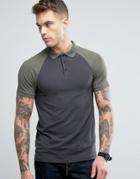 Asos Muscle Polo Shirt With Contrast Raglan In Washed Black And Green