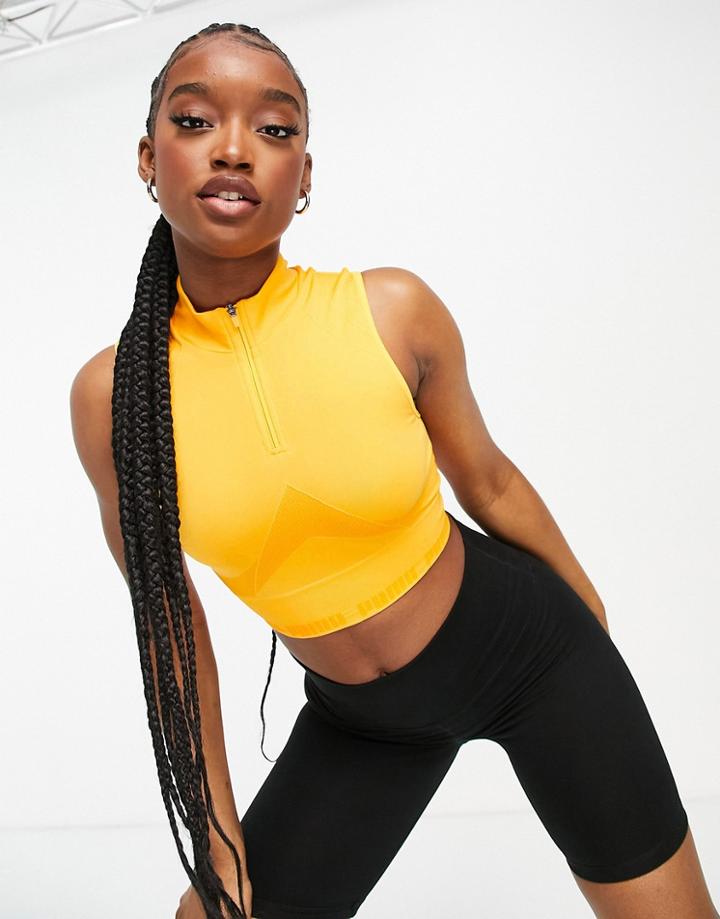 Puma Training Contour Seamless Sleeveless Crop Top In Orange-yellow