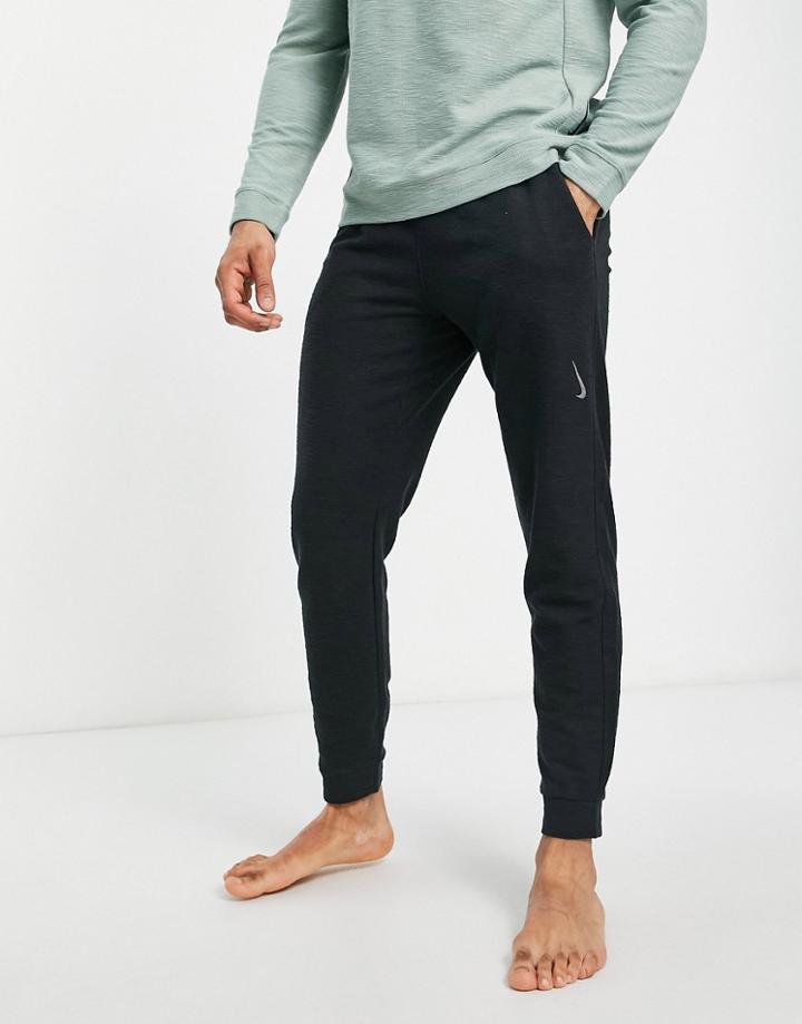 Nike Yoga Dri-fit Essential Fleece Cuffed Sweatpants In Black