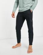 Nike Yoga Dri-fit Essential Fleece Cuffed Sweatpants In Black