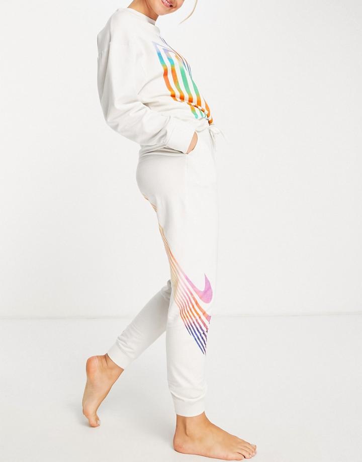 Nike Yoga Therma-fit Luxe A.i.r. Graphic Cuffed Sweatpants In Cream-neutral