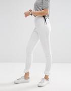 Asos Rivington High Waisted Denim Jeggings In White With Frill Hem - White