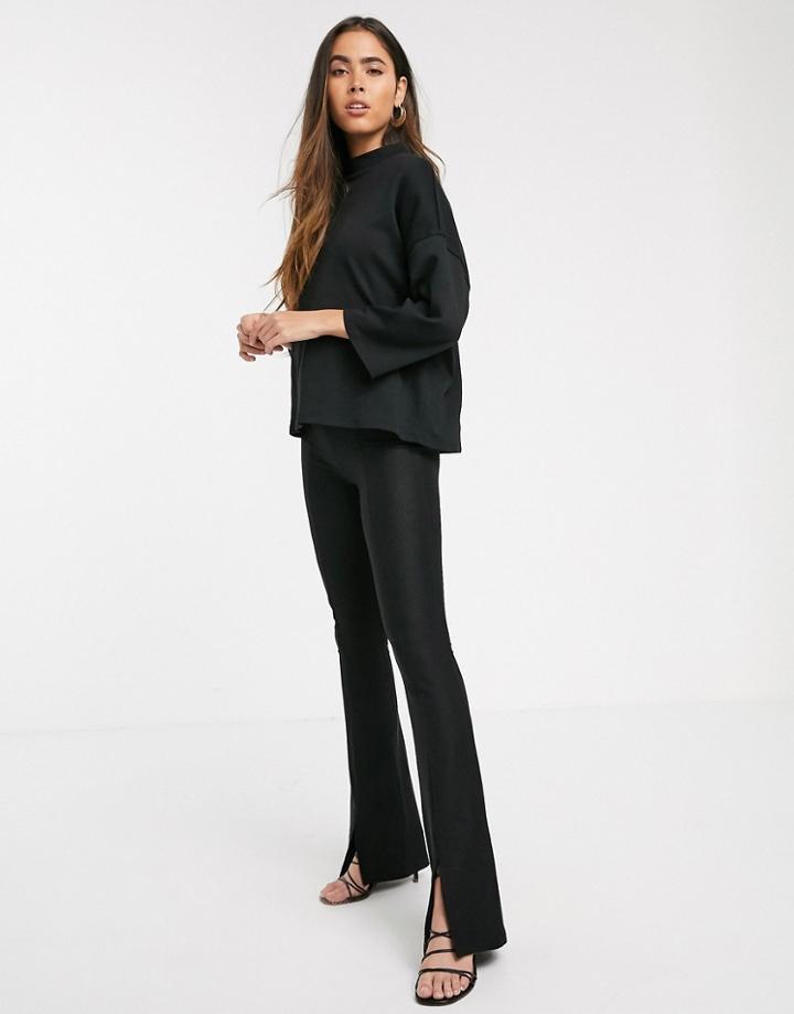 Stradivarius Ribbed Jersey Flare Pants With Slit In Black