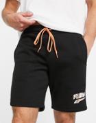 Puma Logo Jersey Shorts In Black And Orange