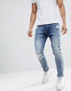 Stradivarius Slim Tapered Jeans With Paint Splat In Mid Blue - Blue