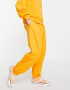 Asos Design Set Super Oversized Sweatpants With Pocket In Bright Orange