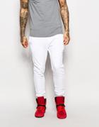 Criminal Damage Skinny Joggers With Distressing - White