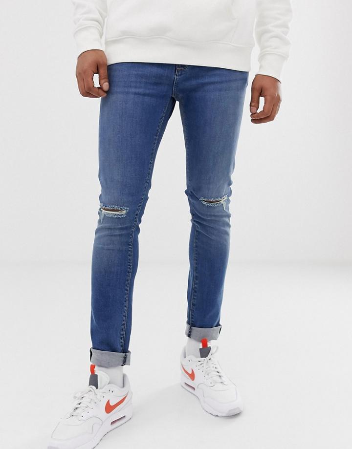 Asos Design Super Skinny Jeans In Mid Wash With Knee Rips-blue