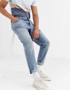 Asos Design Tapered Jeans In Vintage Mid Wash Blue With Self Belt