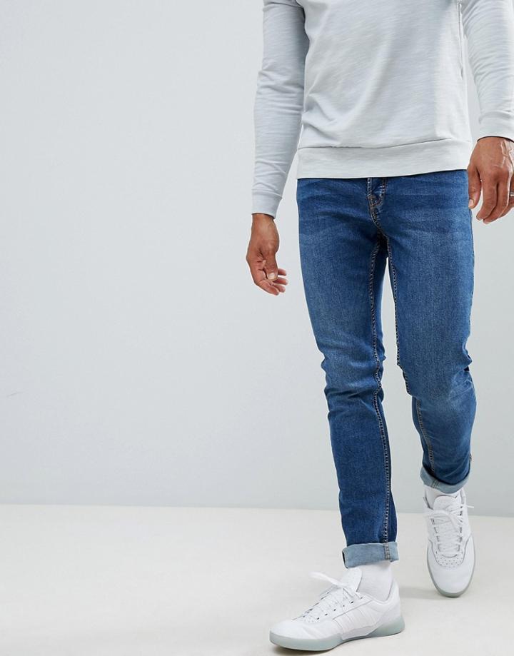 Jack & Jones Slim Taper Jeans In Mid Blue Denim - Blue