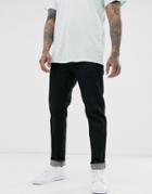 Asos Design Tapered Jeans In Flat Washed Black