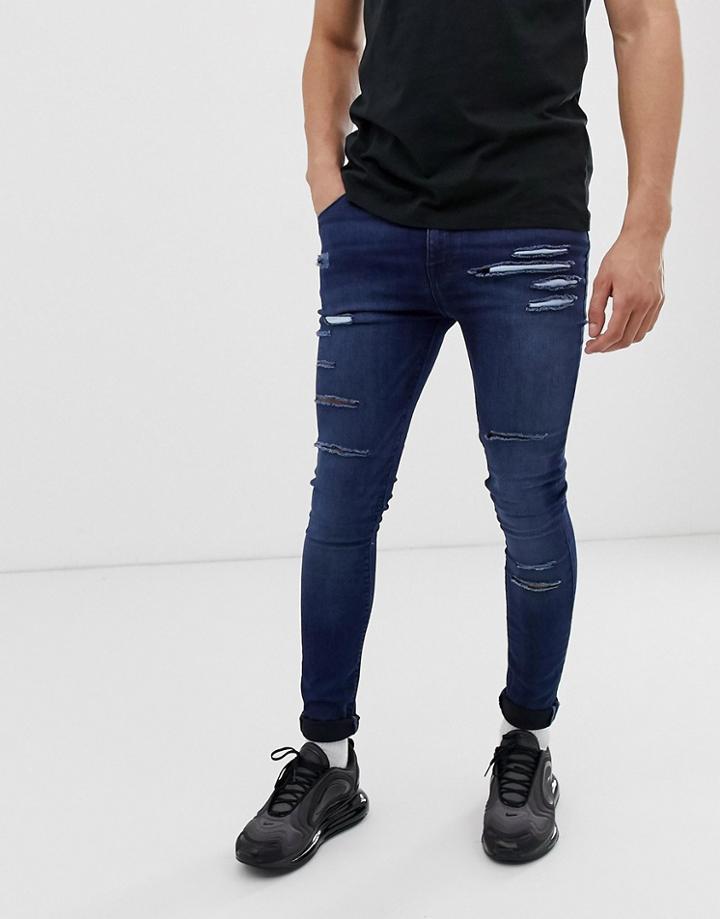 Asos Design Super Spray On Jeans In Dark Wash Blue
