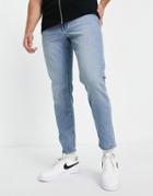Asos Design Tapered Jeans In Light Wash Blue-blues