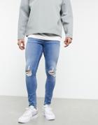 Asos Design Spray On Jeans With Power Stretch In Vintage Mid Wash Blue With Knee Rips-blues