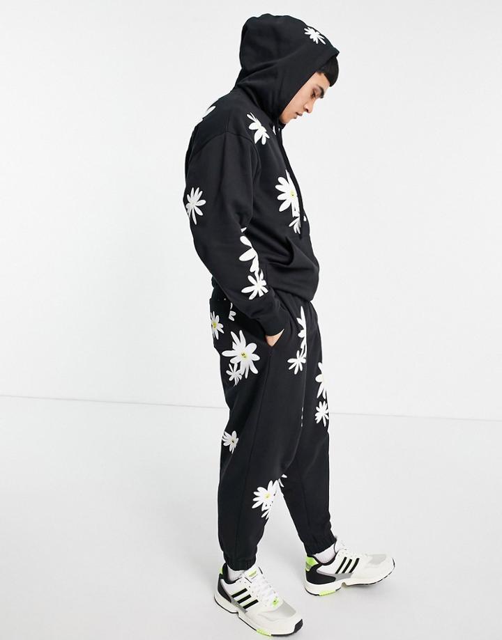 Asos Design Oversized Sweatpants In Black With All Over Daisy Prints - Part Of A Set
