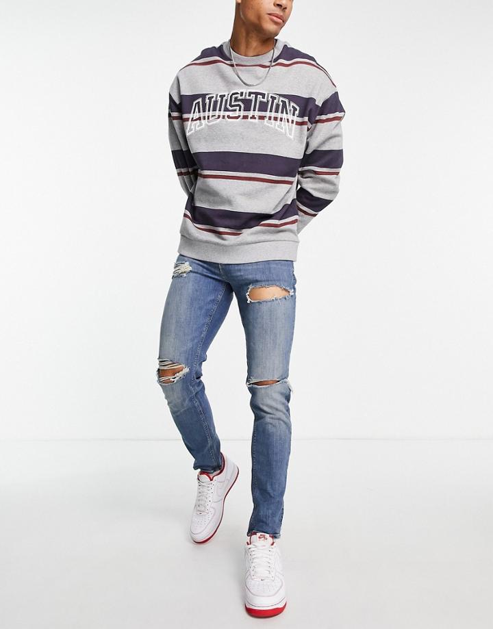 Asos Design Skinny Jeans In Tinted Mid Wash Blue With Heavy Rips-blues