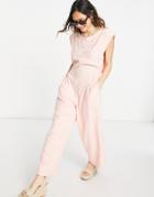 Free People Heat Wave Relaxed Jumpsuit In Grapefruit-pink