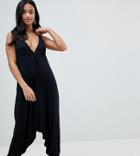 Asos Design Petite Jersey Jumpsuit With Halterneck And Drop Crotch - Black