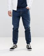 Asos Slim Tapered Jogger Jeans In Mid Blue - Mid Blue