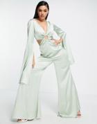 Asos Design Satin Ring Detail Cut Out Extreme Flare Sleeve Jumpsuit In Sage-green