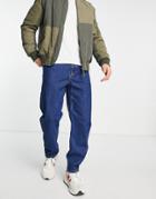 Topman Curved Leg Tapered Jeans In Indigo-blue