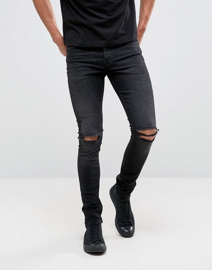 Asos Design Super Skinny 12.5oz Jeans With Knee Rips In Washed Black