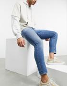 Asos Design Cropped Skinny Jeans In Vintage Mid Wash With Abrasions-blue
