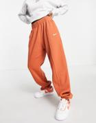 Nike Collection Fleece Loose-fit Cuffed Sweatpants In Terracotta-orange