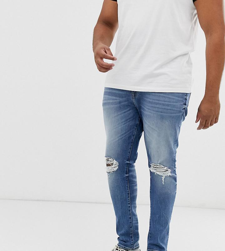 Asos Design Plus 12.5oz Super Skinny Jeans In Mid Wash Blue With Busted Knees